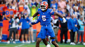 Nov 29, 2025; Gainesville, Florida, USA; Florida Gators linebacker Myles Graham (5) celebrates after a sack against the Florida State Seminoles during the first half at Ben Hill Griffin Stadium.
