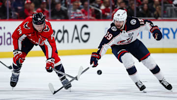 Blue Jackets forward Adam Fantilli competes with Washington defenseman John Carlson. 