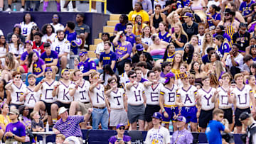 Sep 7, 2024; Baton Rouge, Louisiana, USA; LSU Tigers student section fans paint their chest Back In the Bayou during pregame before the game against the Nicholls State Colonels at Tiger Stadium. Mandatory Credit: Stephen Lew-Imagn Images