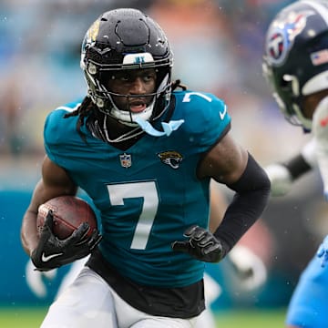 Jacksonville Jaguars wide receiver Brian Thomas Jr. (7) rushes for yards during the second quarter of an NFL football matchup Sunday, Dec. 29, 2024 at EverBank Stadium in Jacksonville, Fla. [Corey Perrine/Florida Times-Union]