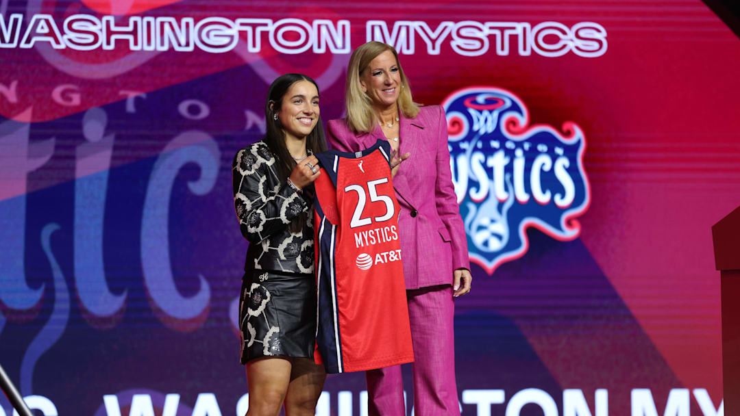 Apr 14, 2025; New York, New York, USA; Georgia Amoore poses with WNBA commissioner Cathy Engelbert after being selected with the number six overall pick to the Washington Mystics in the 2025 WNBA Draft at The Shed at Hudson Yards. Mandatory Credit: Vincent Carchietta-Imagn Images 