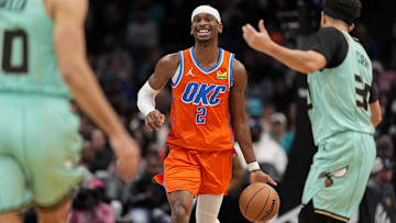 Dec 28, 2024; Charlotte, North Carolina, USA; Oklahoma City Thunder guard Shai Gilgeous-Alexander (2) brings the ball up court against the Charlotte Hornets during the second half at Spectrum Center. Mandatory Credit: Jim Dedmon-Imagn Images