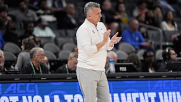 Mar 12, 2025; Charlotte, NC, USA; Stanford Cardinal head coach Kyle Smith applauds his team against the California Golden Bears during the first half at Spectrum Center. Mandatory Credit: Jim Dedmon-Imagn Images
