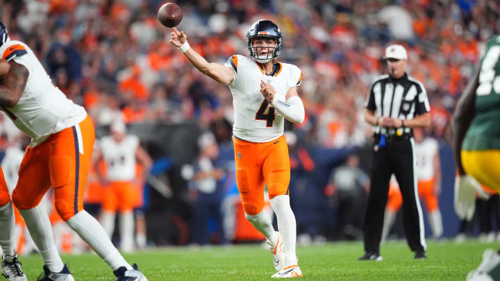 Denver Broncos quarterback Zach Wilson (4) passes the ball in the second half against the Green Bay Packers at Empower Field at Mile High.