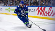 Nov 16, 2024; Vancouver, British Columbia, CAN; Vancouver Canucks forward J.T. Miller (9) handles the puck against the Chicago Blackhawks during the first period at Rogers Arena. Mandatory Credit: Bob Frid-Imagn Images
