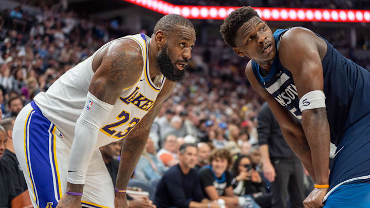 Apr 27, 2025; Minneapolis, Minnesota, USA; Minnesota Timberwolves guard Anthony Edwards (5) guards Los Angeles Lakers forward LeBron James (23) in the second quarter during game four of first round for the 2025 NBA Playoffs at Target Center. Mandatory Credit: Matt Blewett-Imagn Images