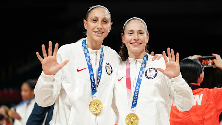 Aug 8, 2021; Saitama, Japan; United States players Diana Taurasi and Sue Bird celebrate with their gold medals after the women's basketball gold medal match during the Tokyo 2020 Olympic Summer Games at Saitama Super Arena. Mandatory Credit: James Lang-Imagn Images