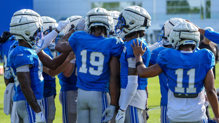 The wide receivers huddle up after running drills, during the Detroit Lions training camp at their training facility in Allen Park, Mich. on Monday, July 29, 2024.