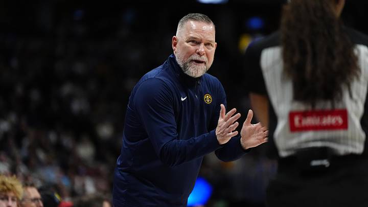 Apr 6, 2025; Denver, Colorado, USA; Denver Nuggets head coach Michael Malone reacts towards referee Danielle Scott (87) in the second half against the Indiana Pacers at Ball Arena. Mandatory Credit: Ron Chenoy-Imagn Images