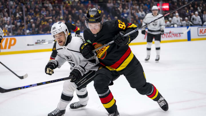 Mar 25, 2024; Vancouver, British Columbia, CAN; Los Angeles Kings forward Viktor Arvidsson (33) battles with Vancouver Canucks forward Vasily Podkolzin (92) in the first period at Rogers Arena. Mandatory Credit: Bob Frid-USA TODAY Sports