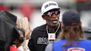 Oct 11, 2025; Boulder, Colorado, USA; Colorado Buffaloes head coach Deion Sanders is interviewed by ESPN during a time out in the first quarter against the Iowa State Cyclones at Folsom Field. Mandatory Credit: Ron Chenoy-Imagn Images