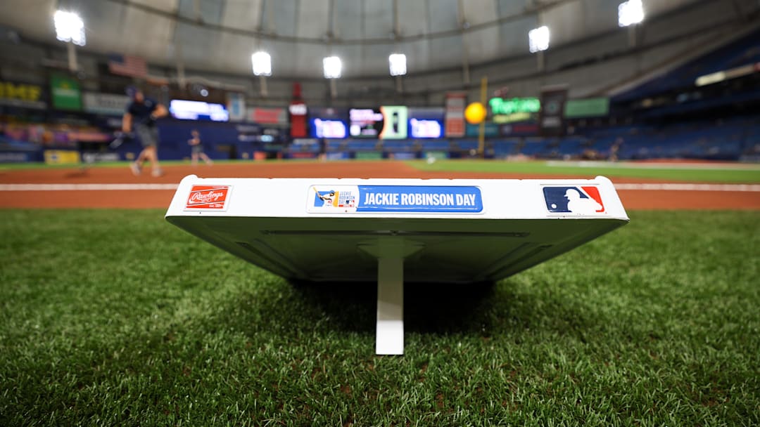 a base displays the Jackie Robinson day logo before the start of a game between the Los Angeles Angels and Tampa Bay Rays at Tropicana Field. a base displays the Jackie Robinson day logo before the start of a game between the Los Angeles Angels and Tampa Bay Rays at Tropicana Field.
