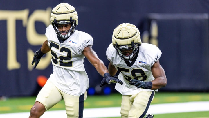 New Orleans Saints linebackers D'Marco Jackson (52) and  linebacker Anfernee Orji (58) work on defensive drills during training camp