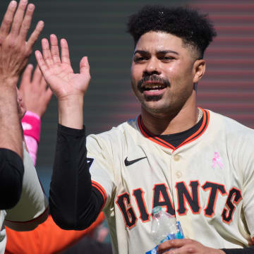 May 12, 2024; San Francisco, California, USA; San Francisco Giants infielder LaMonte Wade Jr. (31) celebrates with his teammates after the game against the Cincinnati Reds at Oracle Park