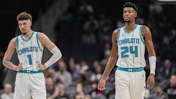 Oct 8, 2024; Charlotte, North Carolina, USA; Charlotte Hornets guard LaMelo Ball (1) and forward Brandon Miller (24) at mid court against the Miami Heat during the second half at Spectrum Center. Mandatory Credit: Jim Dedmon-Imagn Images