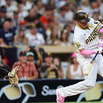 San Diego Padres third baseman Manny Machado (13) singles against the San Francisco Giants in the fifth inning at Petco Park on Sept 7.