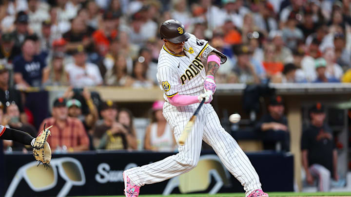 San Diego Padres third baseman Manny Machado (13) singles against the San Francisco Giants in the fifth inning at Petco Park on Sept 7.