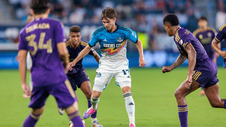 Aug 24, 2024; Kansas City, Kansas, USA; Sporting Kansas City midfielder Jake Davis (17) takes control of the ball during the second half against Orlando City at Children's Mercy Park. Mandatory Credit: William Purnell-USA TODAY Sports