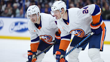 Feb 1, 2025; Tampa, Florida, USA; New York Islanders center Jean-Gabriel Pageau (44) talks to New York Islanders defenseman Scott Mayfield (24) against the Tampa Bay Lightning in the second period at Amalie Arena. Mandatory Credit: Nathan Ray Seebeck-Imagn Images