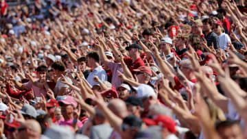 Oklahoma fans stand before a college football game between the University of Oklahoma Sooners (OU) and the Arkansas State Red Wolves at Gaylord Family-Oklahoma Memorial Stadium in Norman, Okla. Oklahoma won 73-0.