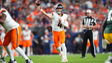 Aug 18, 2024; Denver, Colorado, USA; Denver Broncos quarterback Zach Wilson (4) passes the ball in the second half against the Green Bay Packers at Empower Field at Mile High. Mandatory Credit: Ron Chenoy-Imagn Images