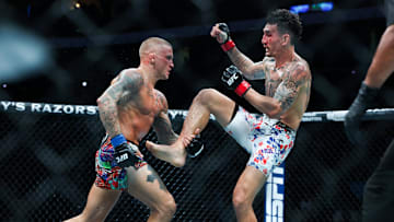 Max Holloway fights against Dustin Poirier during UFC 318 at Smoothie King Center. 