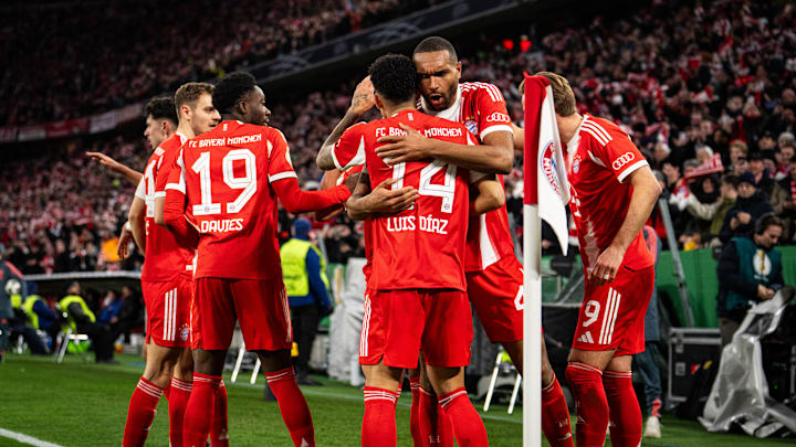 Bayern Munich players celebrating against RB Leipzig in DFB Pokal at Allianz Arena.