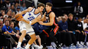 Oct 12, 2025; Orlando, Florida, USA; Miami Heat guard Pelle Larsson (9) defends Orlando Magic forward Franz Wagner (22) during the first half at Kia Center. Mandatory Credit: Matt Pendleton-Imagn Images