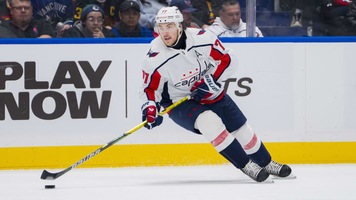 Mar 16, 2024; Vancouver, British Columbia, CAN; Washington Capitals forward TJ Oshie (77) handles the puck against the Vancouver Canucks in the second period at Rogers Arena. Mandatory Credit: Bob Frid-USA TODAY Sports