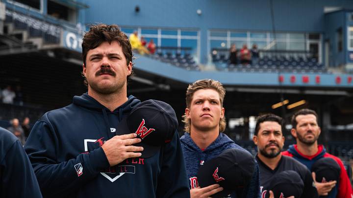Pitchers Payton Tolle (left) and Connelly Early (second from left) stand for the national anthem ahead of Triple-A Worcester's game at Polar Park on Aug. 21, 2025.