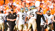 Head coach Jake Dickert embraces defensive back Nick Andersen (45) following Wake Forest's 30-23 win over Virginia Tech at Lane Stadium in Blacksburg, VA.