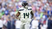 Dec 8, 2024; Glendale, Arizona, USA; Seattle Seahawks wide receiver DK Metcalf (14) against the Arizona Cardinals at State Farm Stadium. Mandatory Credit: Mark J. Rebilas-Imagn Images