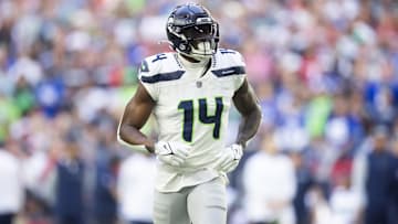 Dec 8, 2024; Glendale, Arizona, USA; Seattle Seahawks wide receiver DK Metcalf (14) against the Arizona Cardinals at State Farm Stadium. Mandatory Credit: Mark J. Rebilas-Imagn Images