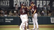 May 17, 2024; College Station, Texas; USA: Texas A&M Aggies pitcher Justin Lamkin speaks with the catcher a pitching coach during a mound meeting.