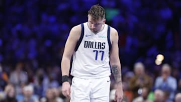 Dec 10, 2024; Oklahoma City, Oklahoma, USA; Dallas Mavericks guard Luka Doncic (77) walks down the court during a time out against the Oklahoma City Thunder during the second half at Paycom Center. Mandatory Credit: Alonzo Adams-Imagn Images