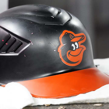 Mar 30, 2025; Toronto, Ontario, CAN; A detail view of a Baltimore Orioles batting helmet during a game against the Toronto Blue Jays at Rogers Centre. 
