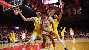 Feb 1, 2025; Piscataway, New Jersey, USA; Rutgers Scarlet Knights guard Ace Bailey (4) is guarded by Michigan Wolverines center Vladislav Goldin (50) and guard Roddy Gayle Jr. (11) during the second half at Jersey Mike's Arena. Mandatory Credit: Vincent Carchietta-Imagn Images
