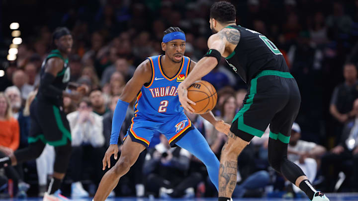 Jan 2, 2024; Oklahoma City, Oklahoma, USA; Oklahoma City Thunder guard Shai Gilgeous-Alexander (2) defends Boston Celtics forward Jayson Tatum (0) during the second quarter at Paycom Center. Mandatory Credit: Alonzo Adams-Imagn Images