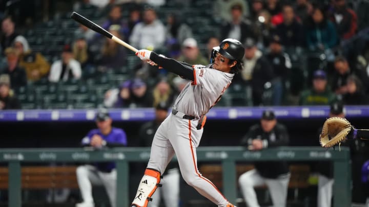 May 8, 2024; Denver, Colorado, USA; San Francisco Giants outfielder Jung Hoo Lee (51) swings the batt in the eighth inning against the Colorado Rockies at Coors Field.