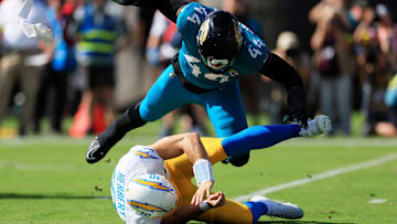 Jacksonville Jaguars defensive end Travon Walker (44) hurries Los Angeles Chargers quarterback Justin Herbert (10) as he is called for intentional grounding during the first quarter of an NFL football game at EverBank Stadium, Sunday, Nov. 16, 2025 in Jacksonville, Fla.