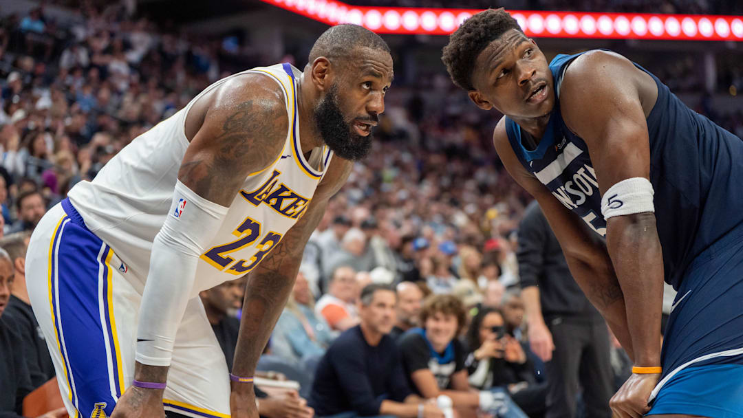 Apr 27, 2025; Minneapolis, Minnesota, USA; Minnesota Timberwolves guard Anthony Edwards (5) guards Los Angeles Lakers forward LeBron James (23) in the second quarter during game four of first round for the 2025 NBA Playoffs at Target Center. Mandatory Credit: Matt Blewett-Imagn Images