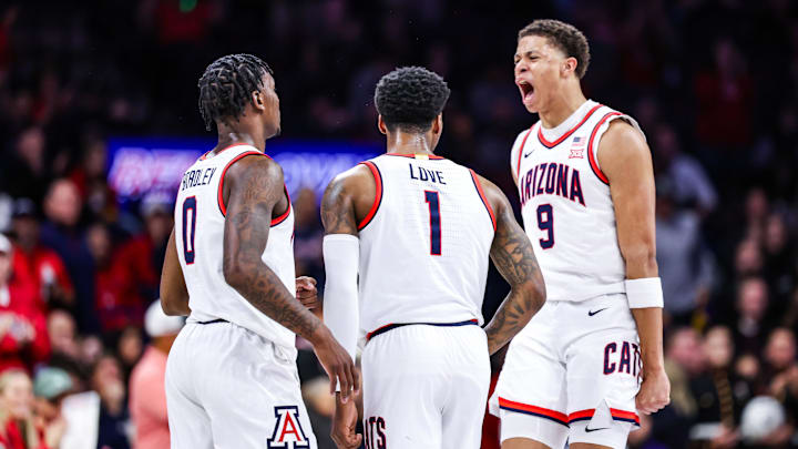 Dec 30, 2024; Tucson, Arizona, USA; Arizona Wildcats guard Caleb Love (1) celebrates a three-point basket with his teammates Arizona Wildcats guard Jaden Bradley (0) and Arizona Wildcats forward Carter Bryant (3) during the first half of the game against the TCU Horned Frogs at McKale Center. Mandatory Credit: Aryanna Frank-Imagn Images