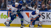 Edmonton Oilers forward Connor McDavid skates past Vancouver Canucks defenseman Carson Soucy. 