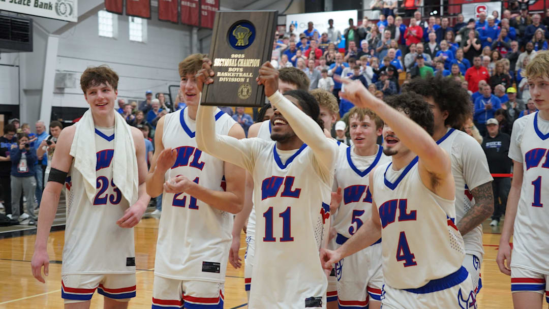 Wisconsin Lutheran Vikings players display the WIAA Division 1 sectional championship plaque after beating West Allis Central on Saturday, March 15, 2025 at Waukesha South High School.