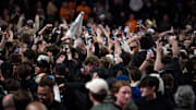Vanderbilt fans storm the court to celebrate their Commodores win over the Tennessee Volunteers after their game at Memorial Gym in Nashville, Tenn., Saturday, Jan. 18, 2025.