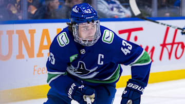 Dec 14, 2024; Vancouver, British Columbia, CAN; Vancouver Canucks defenseman Quinn Hughes (43) skates against the Boston Bruins during the third period at Rogers Arena. Mandatory Credit: Bob Frid-Imagn Images