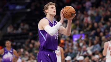 Mar 17, 2025; Salt Lake City, Utah, USA;  Utah Jazz forward Lauri Markkanen (23) shoots a technical free throw during the first quarter against the Chicago Bulls at Delta Center. Mandatory Credit: Chris Nicoll-Imagn Images