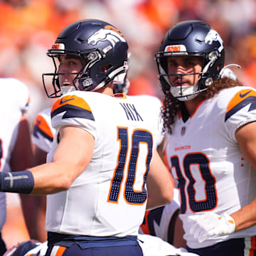 Sep 15, 2024; Denver, Colorado, USA; Denver Broncos quarterback Bo Nix (10) huddles with teammates in the first quarter against the Pittsburgh Steelers at Empower Field at Mile High. 