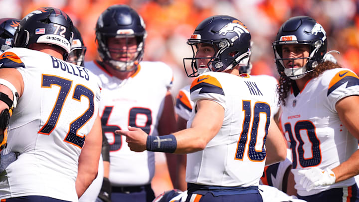 Sep 15, 2024; Denver, Colorado, USA; Denver Broncos quarterback Bo Nix (10) huddles with teammates in the first quarter against the Pittsburgh Steelers at Empower Field at Mile High. 