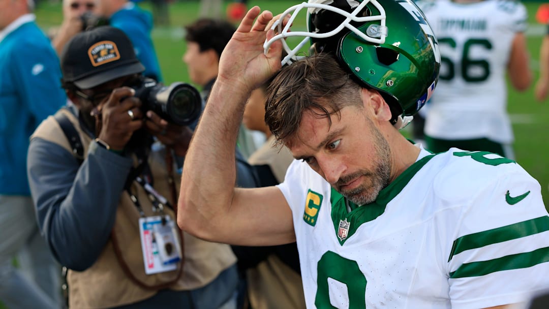 New York Jets quarterback Aaron Rodgers (8) takes off his helmet after the game Sunday, Dec. 15, 2024 at EverBank Stadium in Jacksonville, Fla. 